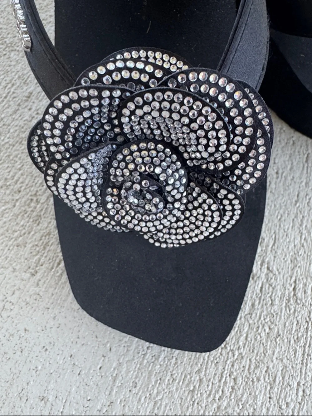 GUESS Black Wedge Sandal with Crystal Flower Accent